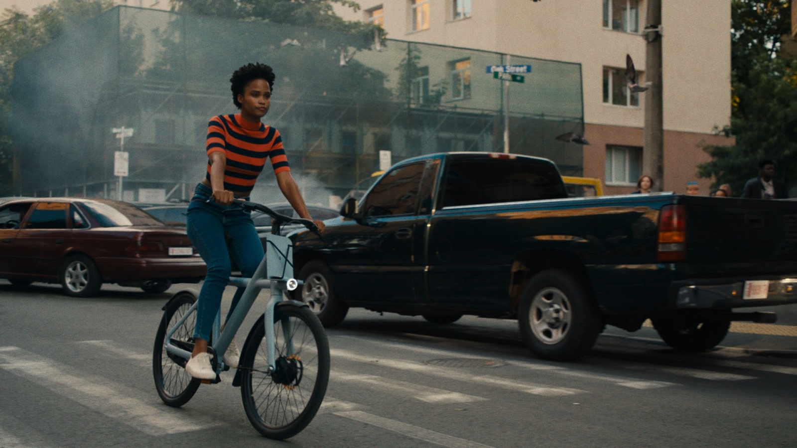 E-Bike Rider Moves Calmly Through the City Chaos